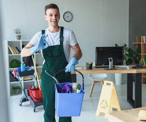 handsome-smiling-young-cleaner-holding-bucket-with-resize-pz06efcnznbwtr3nufxjt6gc4w00i9rqqvp7x9yx6w